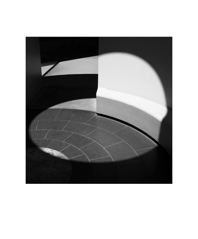 Black and white photograph by Bradley Cummings titled SHADOW PLAY IN THE SKYSPACE, Canberra.