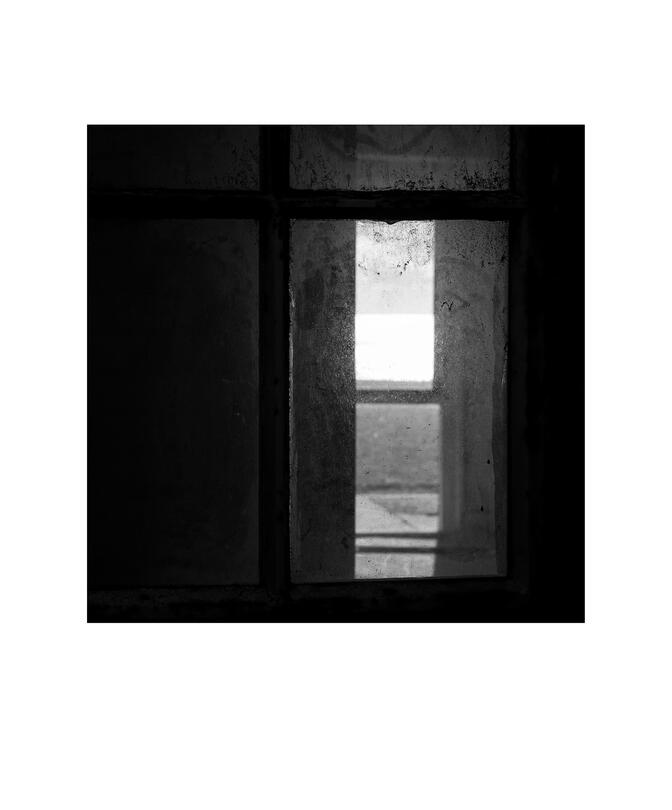 Black and white photograph by Bradley Cummings titled QUARANTINE STATION WINDOW, Point Nepean, 2025.