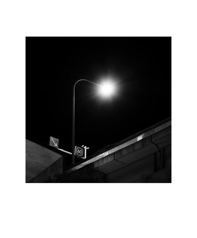 Black and white photograph by Bradley Cummings titled WESTERN DISTRIBUTOR 8PM, Sydney, 2025.