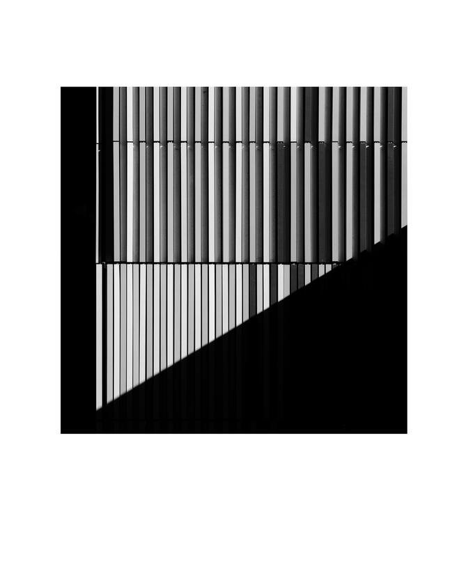 Black and white photograph by Bradley Cummings titled FACADE WITH DIAGONAL SHADOW, Caulfield, Melbourne, 2024.