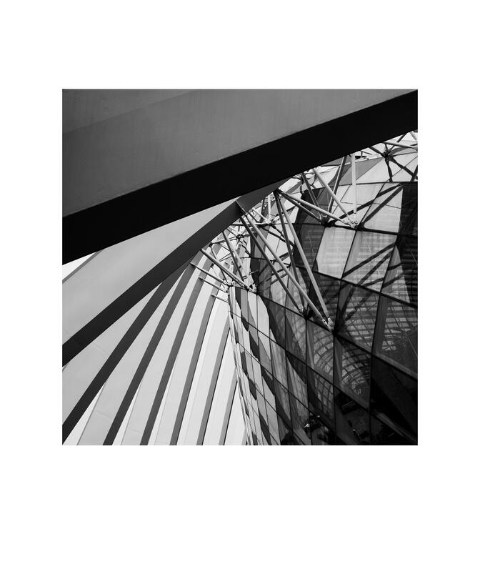 Black and white photograph by Bradley Cummings titled LOOKING UP #23251, Singapore, 2026