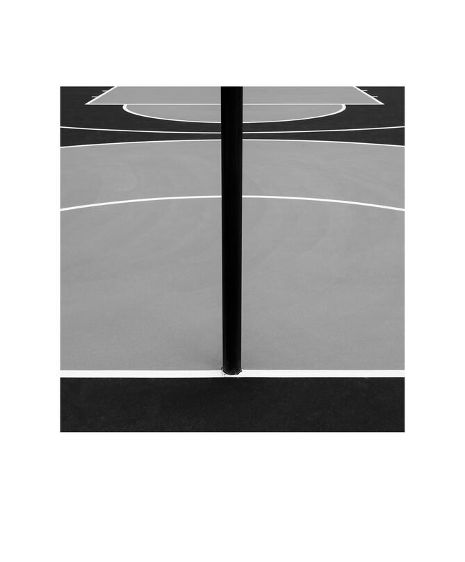 Black and white photograph by Bradley Cummings titled OUTDOOR BASKETBALL COURT, Canberra, 2023